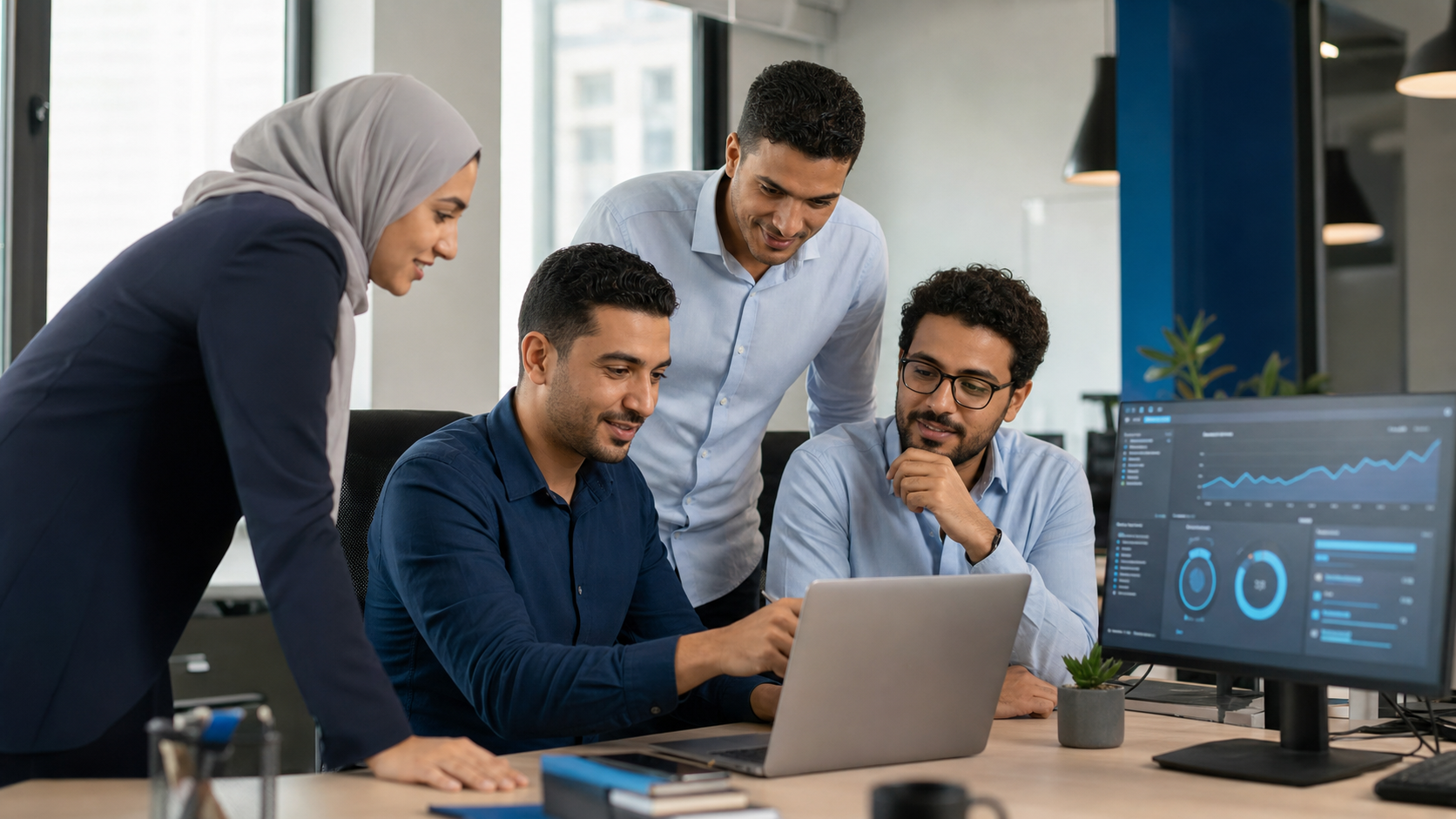 Business team collaborating with an IT specialist